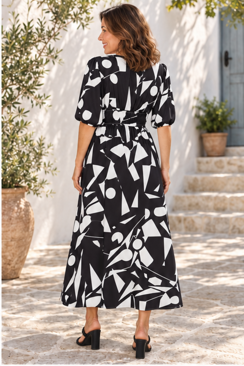 Printed surplice balloon sleeve dress in black, back full-length view